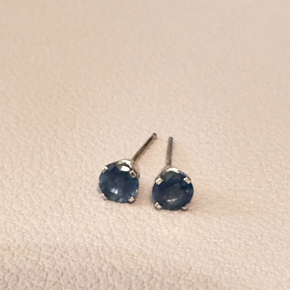 Natural Blue Diamond Studs (1/4 ct), 14K white gold.